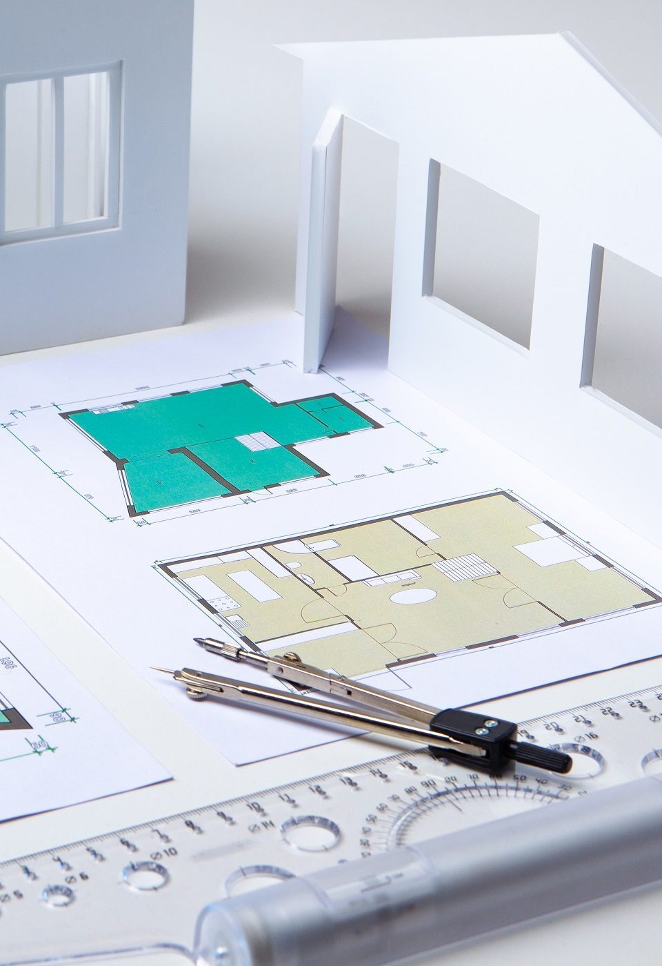 Architectural company. Architect. Office of the architectural bureau. Small copy of the house. Drawings on the architect's desk. Architectural decisions. Work with floor plans. Matching.